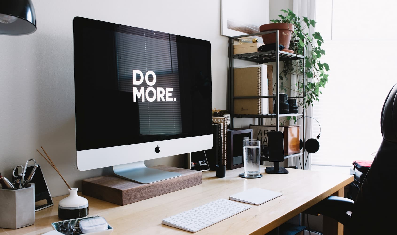 A minimalist desk setup with a monitor, keyboard and mouse for optimal productivity.